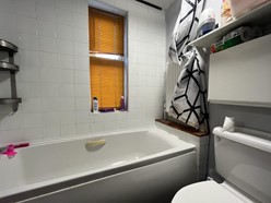 Image of Bathroom (Upstairs flat) - Three piece sweet, UPVC double glazed window and radiator.