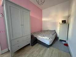 Image of Bedroom one (Upstairs flat) - Double glazed window, laminate flooring and double radiator.